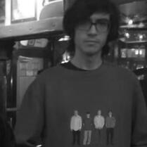 Will Toledo wearing a Weezer shirt.