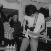 Will Toledo from the band Car Seat Headrest playing the guitar.